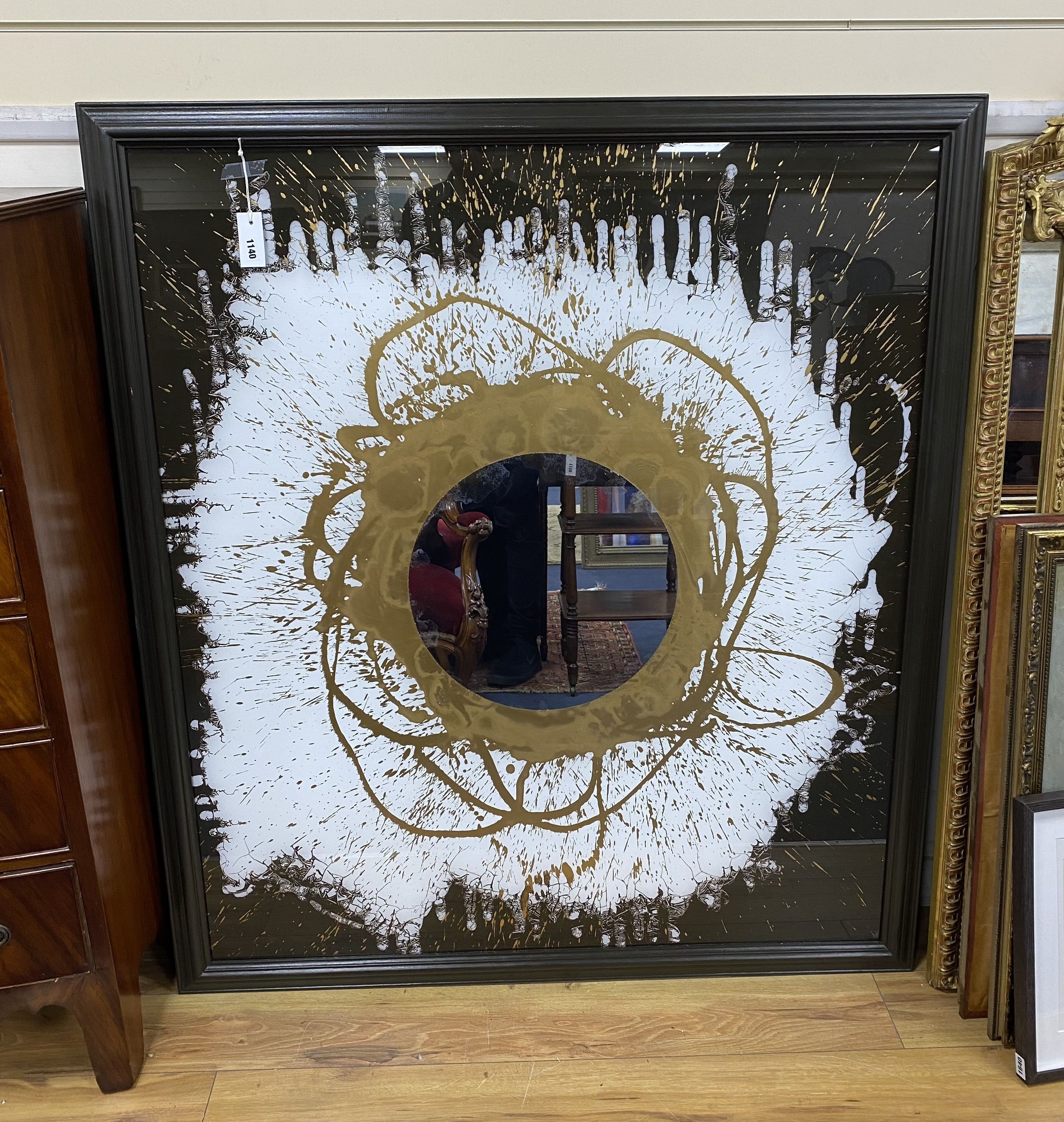 A large contemporary artwork on glass, with abstract pattern and centre mirror in frame, unsigned, width 119cm, height 134cm